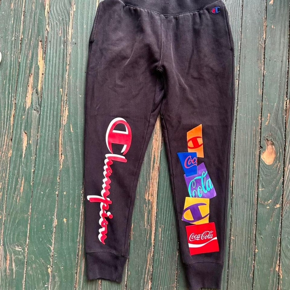 Champion Reverse Weave black joggers with Coca-Cola logo